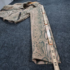 Tan and green Anna Cai snakeskin-print cropped jacket, measuring tape along the sleeve