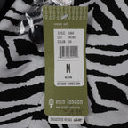 Close-up of size and product information on a Erin London hangtag