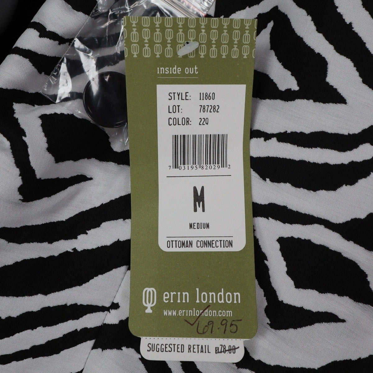 Close-up of size and product information on a Erin London hangtag