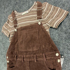 Angled close-up of the front bib, strap fasteners and striped top in a brown Amy Too jumper dress set