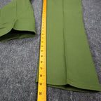 Ruler alongside the inner leg of green Aldens pants