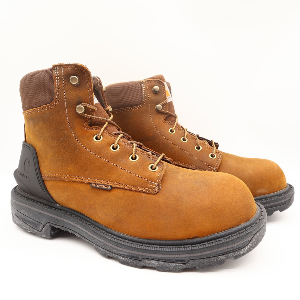 Tan-brown Carhartt lace-up boots with black heel guards, angled front view
