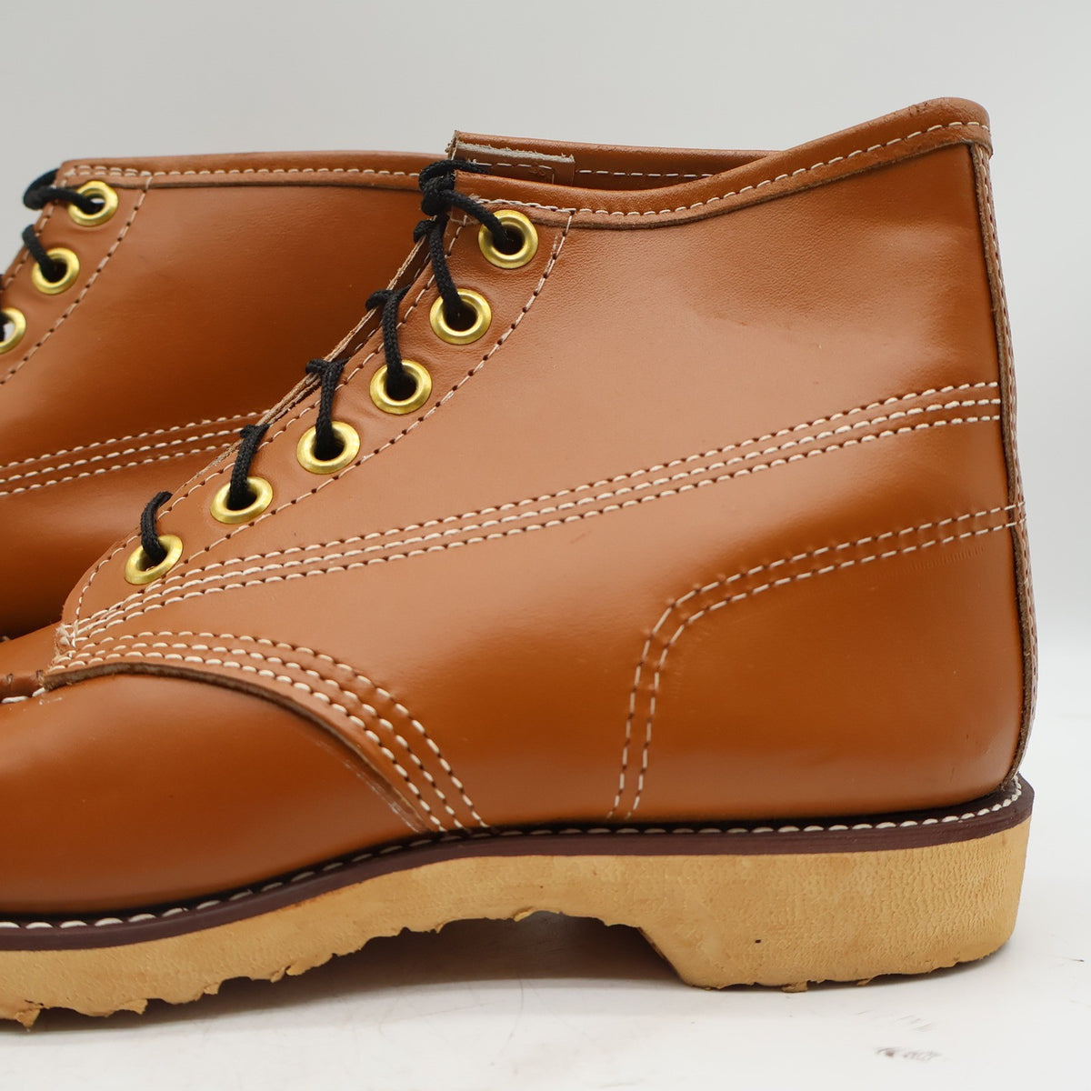 Close-up of side stitching and the cream heel on a Cedar Crest boot
