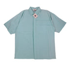 Front view of an aqua blue Alexxus short-sleeve shirt with horizontal chest pleats