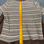 Ruler from the neckline to the hem of the striped Amy Too top laid over a brown jumper dress