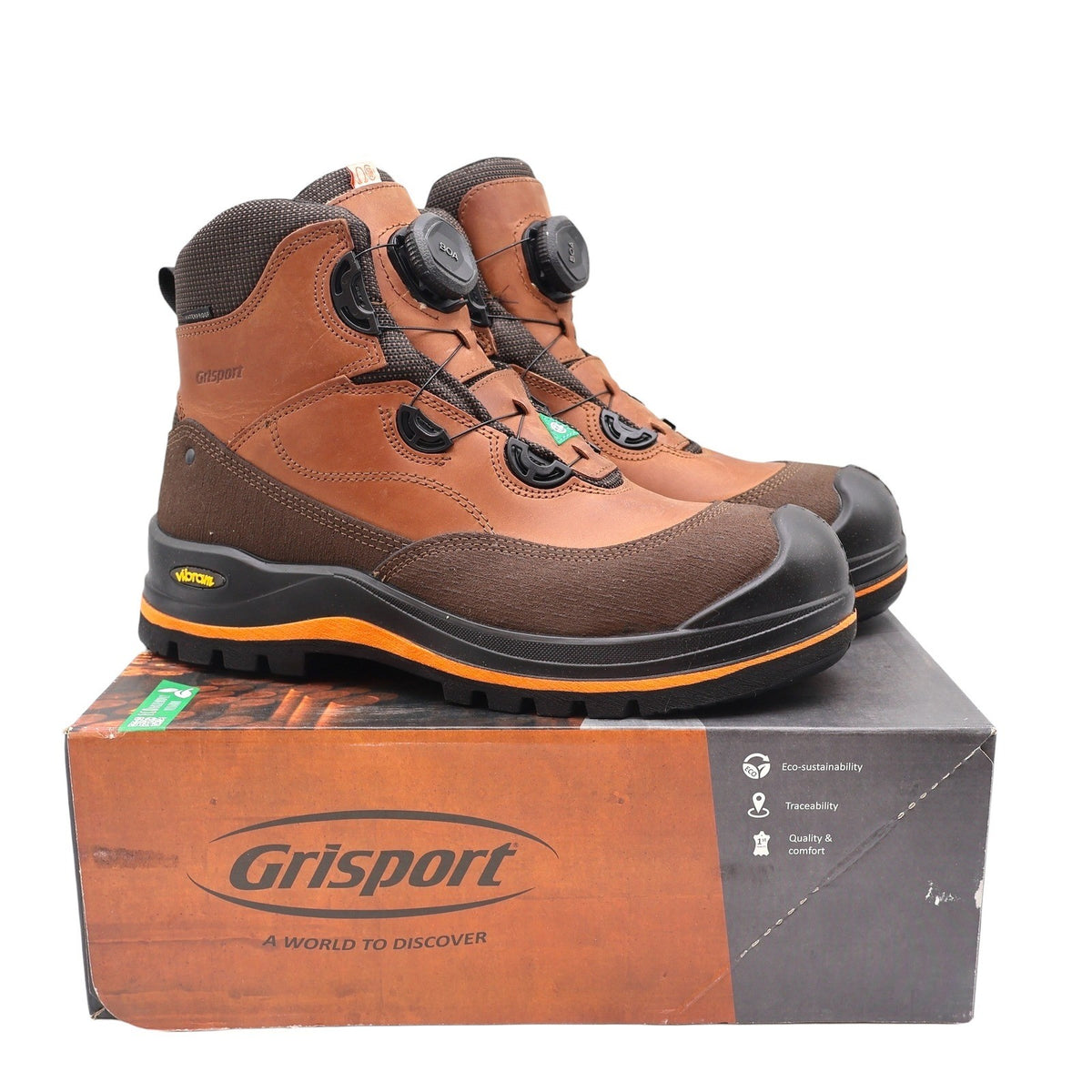 Pair of brown Grisport BOA boots with orange sole stripes displayed on a Grisport shoebox