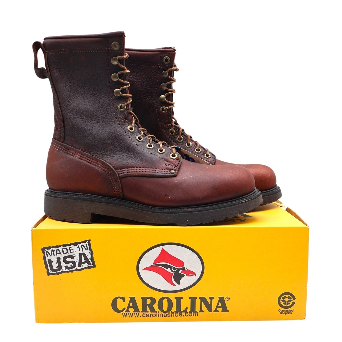 Reddish-brown Carolina lace-up work boots, pair on yellow Carolina box