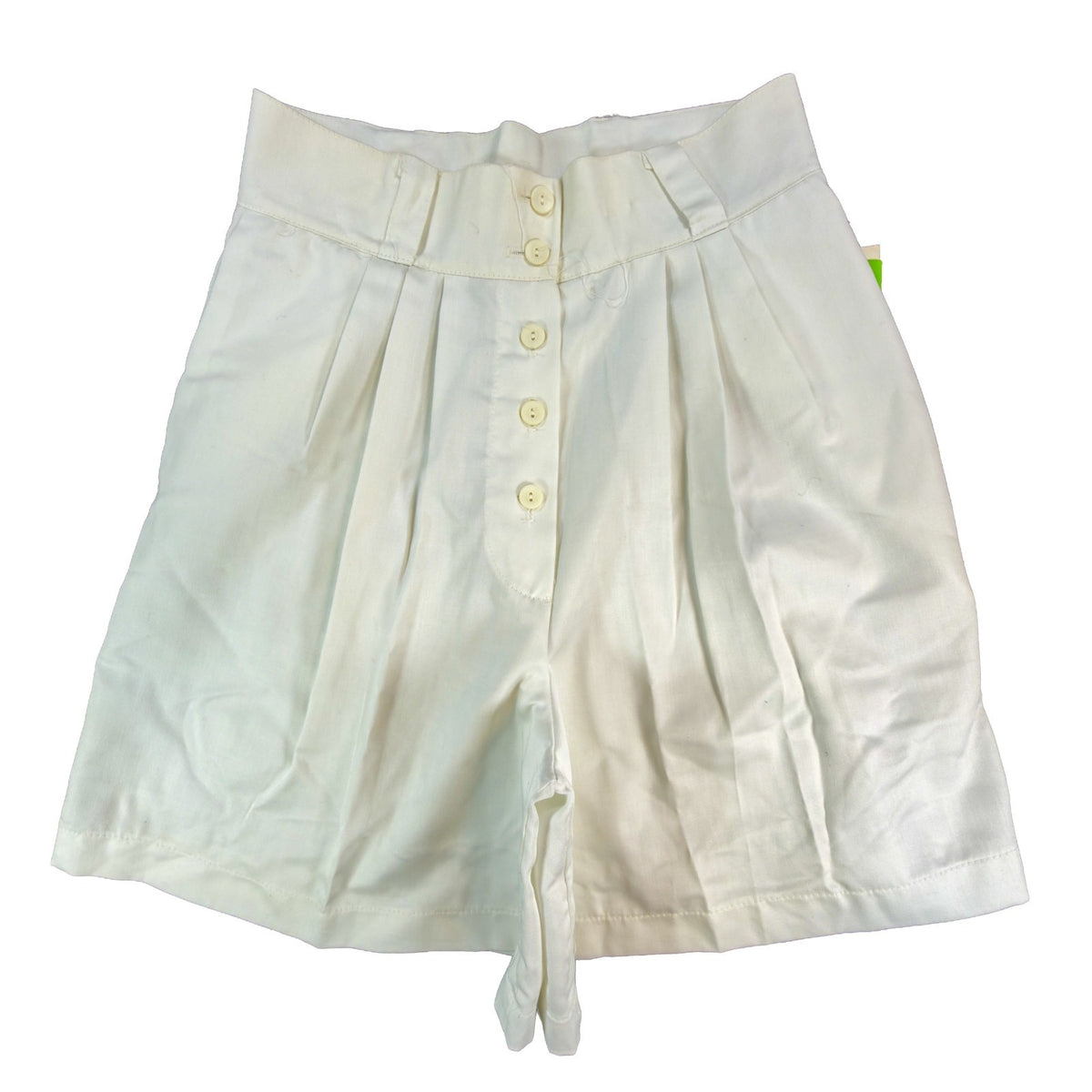 Front view of white Gazelle pleated shorts with a button front