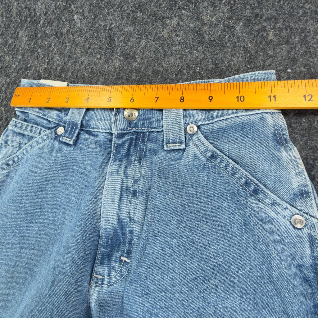 Ruler across the waistband of light blue Lee wide-leg carpenter jeans