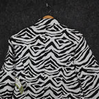 Close-up of the back of black and white zebra-print Erin London blazer