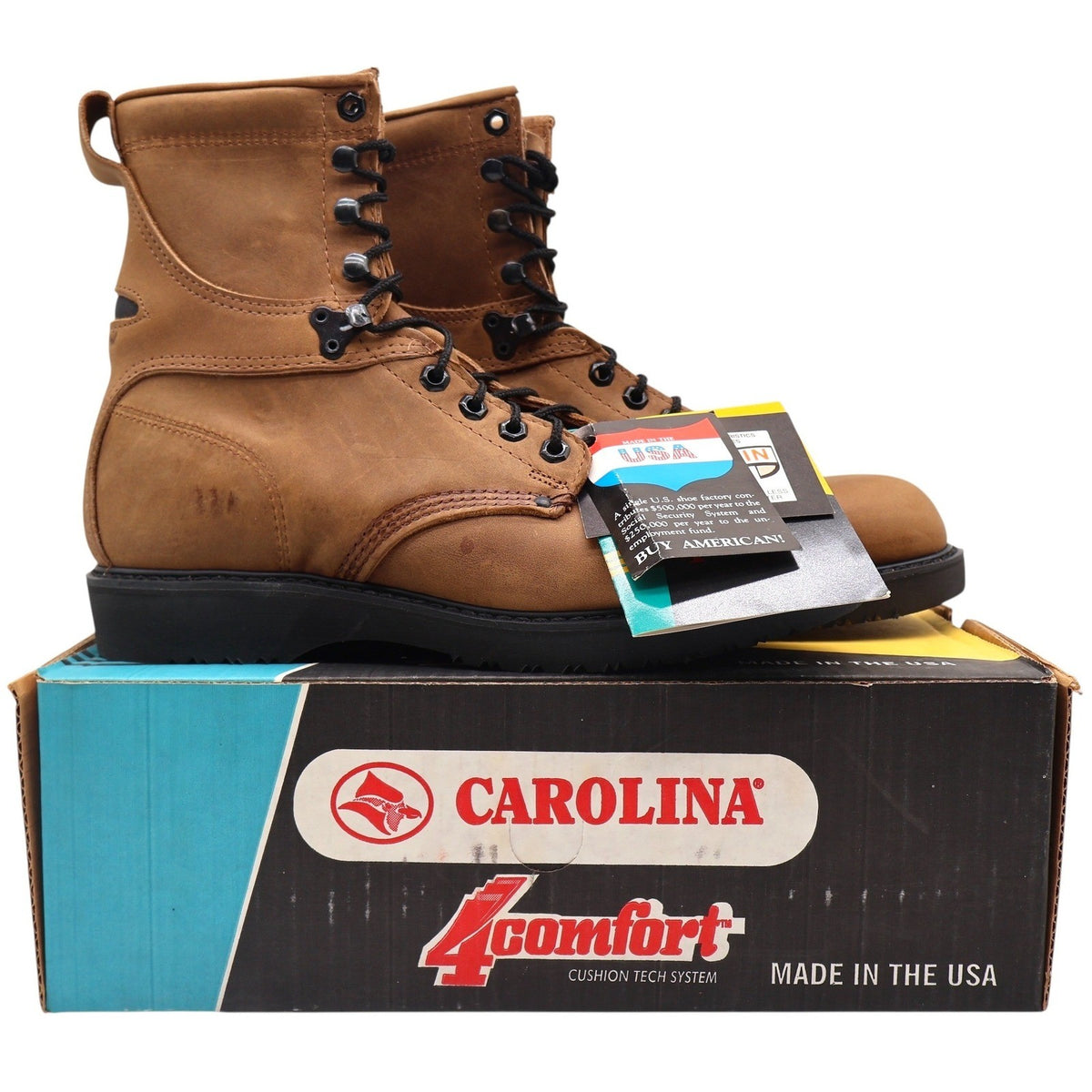 Pair of tan Carolina lace-up boots with black soles displayed on a Carolina shoebox
