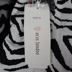Close-up of the Erin London logo side of the hangtag