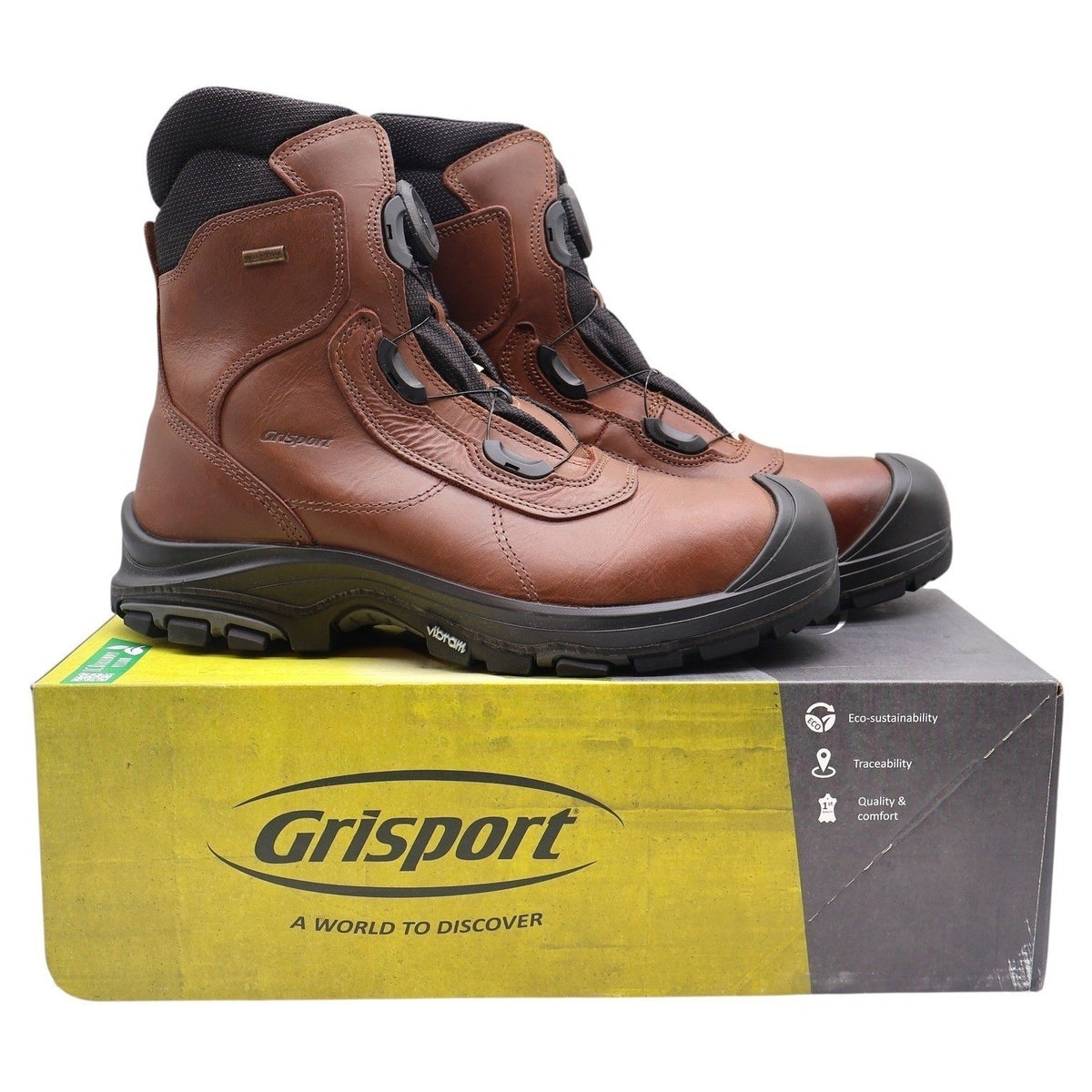 Pair of brown Grisport BOA boots with black toe guards displayed on a Grisport shoebox