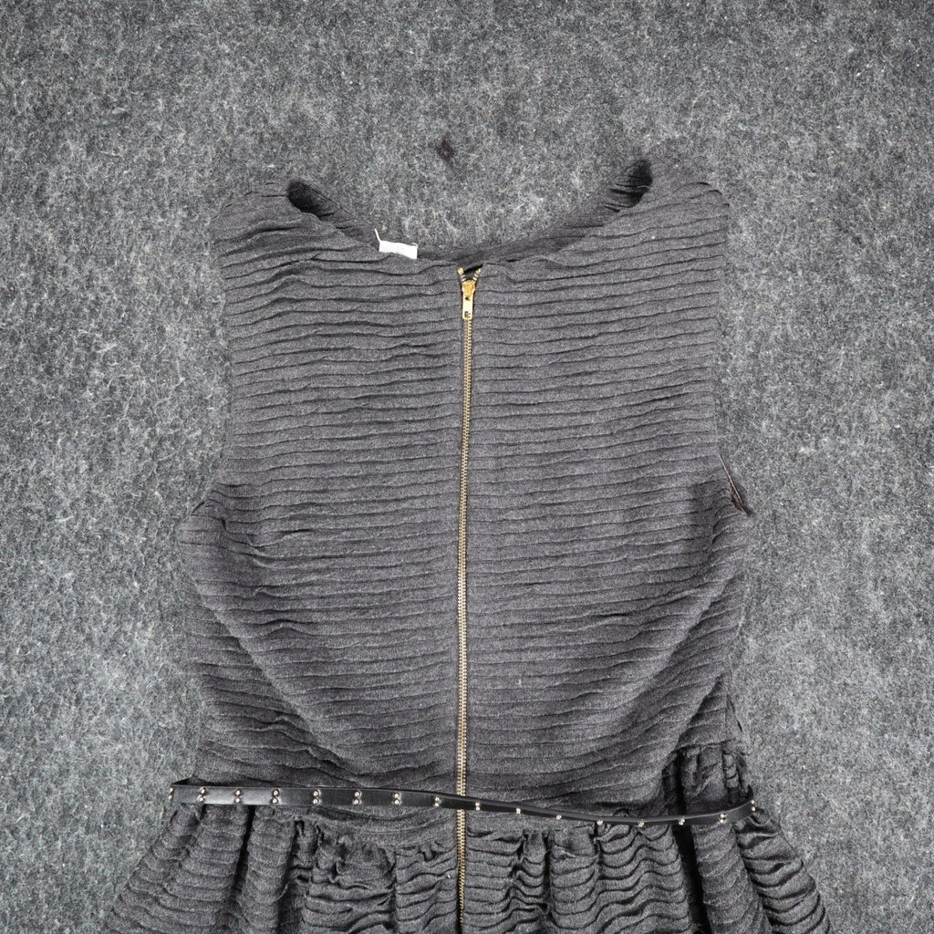 Close-up of the back zipper and belted waist of the gray Esley dress