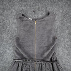 Close-up of the back zipper and belted waist of the gray Esley dress