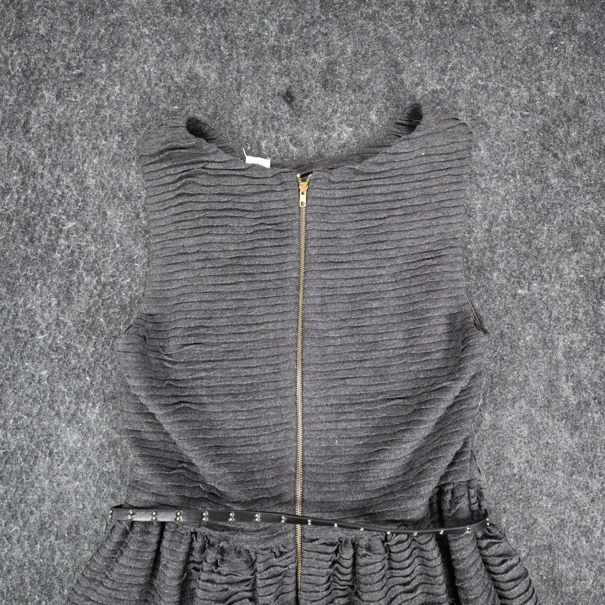 Close-up of the back zipper and belted waist of the gray Esley dress