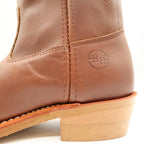 Close-up of the Double-H ankle emblem and tan heel