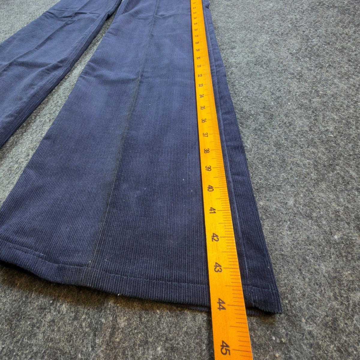 Navy Maverick flared corduroy pants, outer length ruler view
