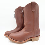 Three-quarter view of brown Double-H pull-on boots with tan soles with toes pointing left