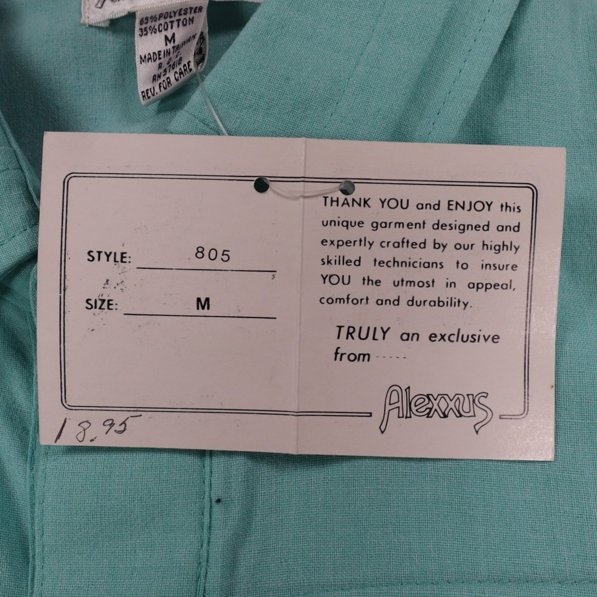 Close-up of size and product information on a Alexxus hangtag