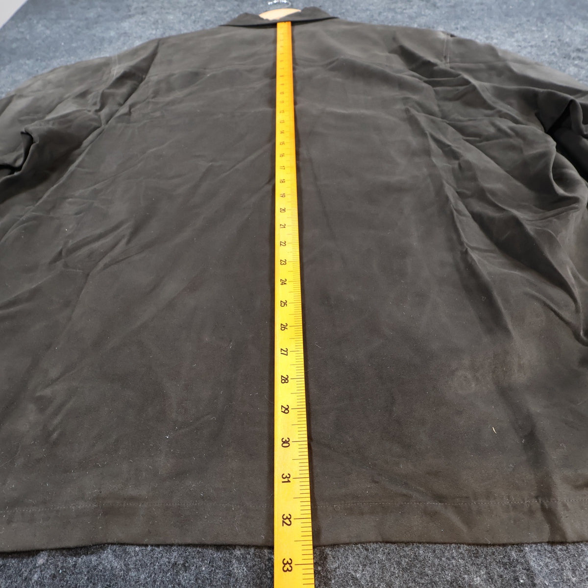 Ruler along the back length of brown Alan Flusser button-front shirt jacket