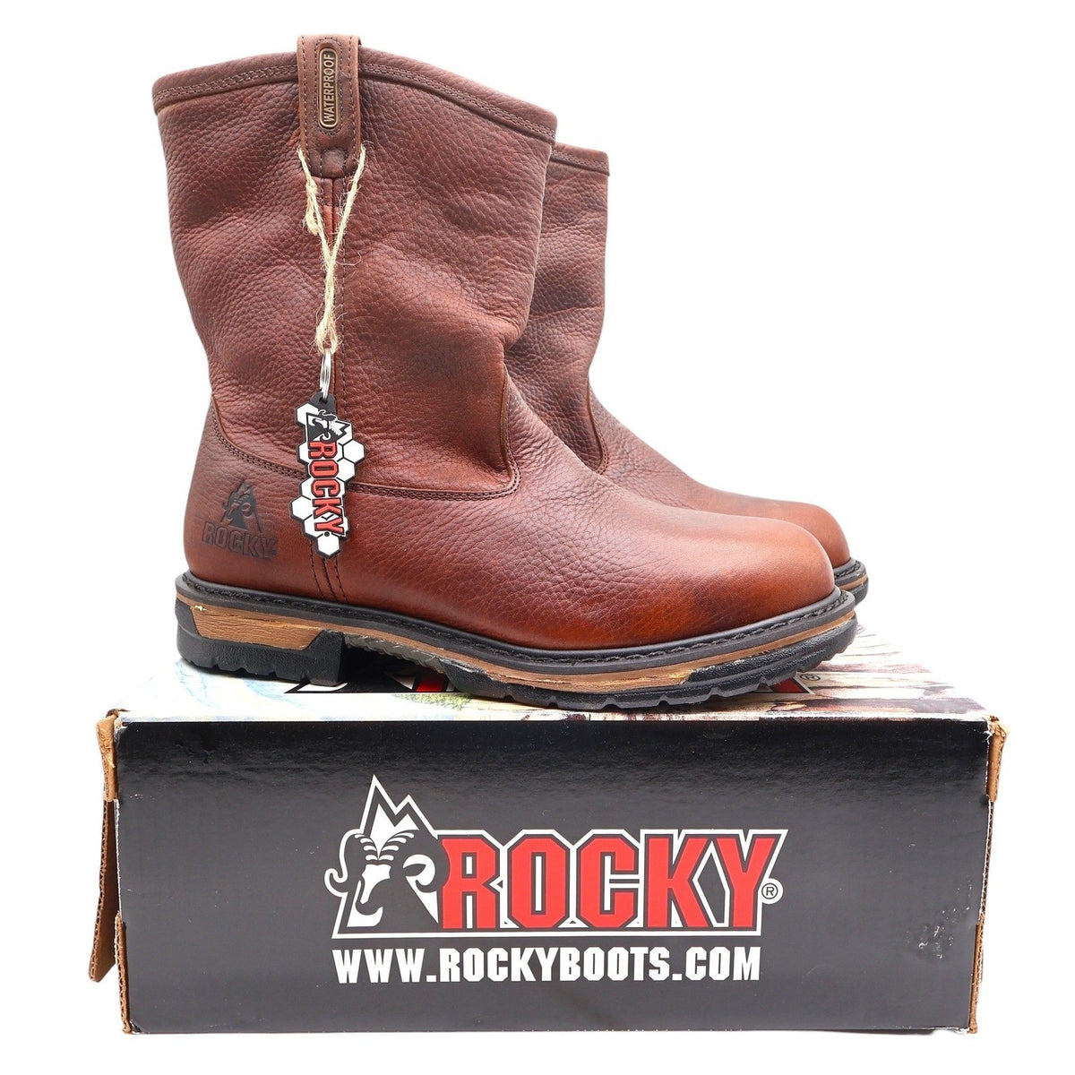 Brown Rocky IronClad pull-on boots with a logo hangtag displayed on a black Rocky box