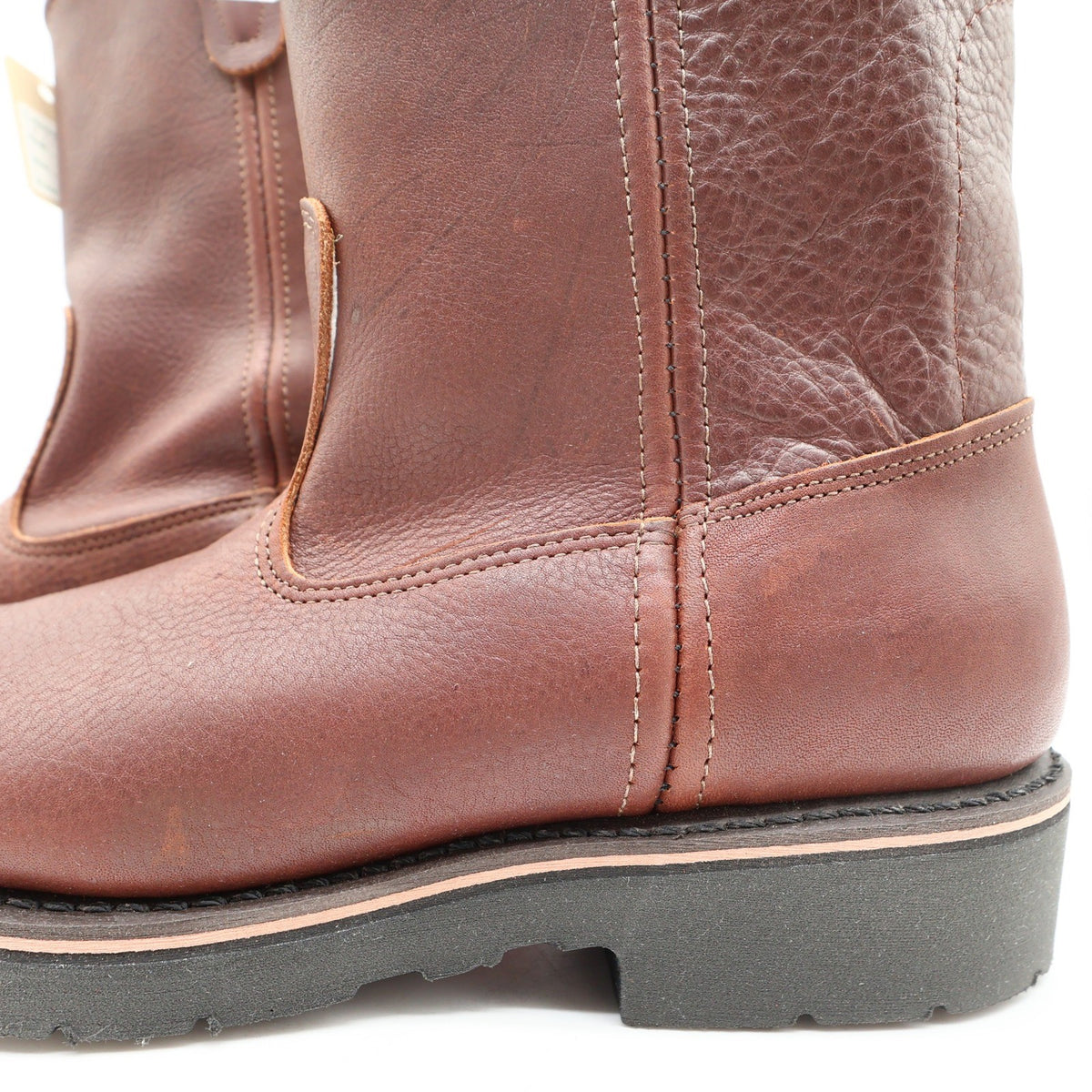 Close-up of side stitching and ankle panels on brown Double-H pull-on boots