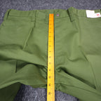Ruler from the waistband to the crotch of green Aldens pants