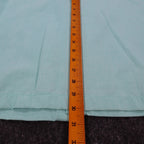 Ruler along the back length of aqua blue Alexxus short-sleeve shirt