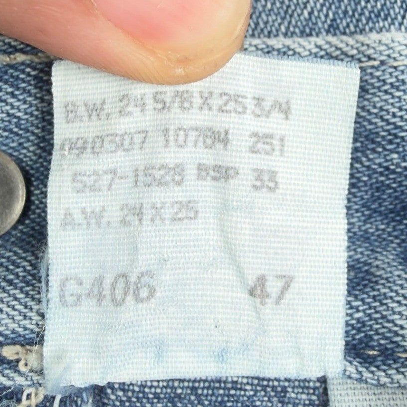 Close-up of faded production codes on an interior label