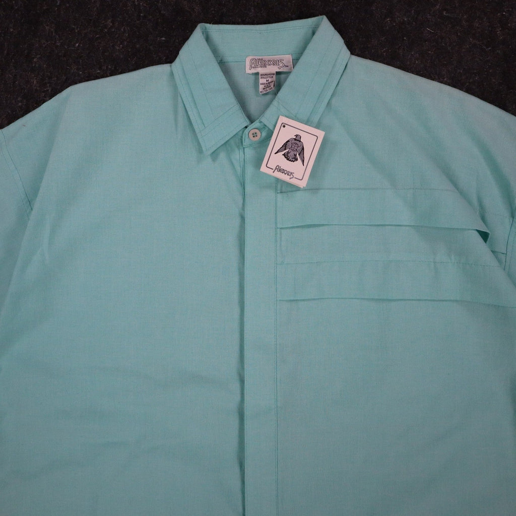 Close-up of the collar and pleated chest panel of an aqua blue Alexxus short-sleeve shirt