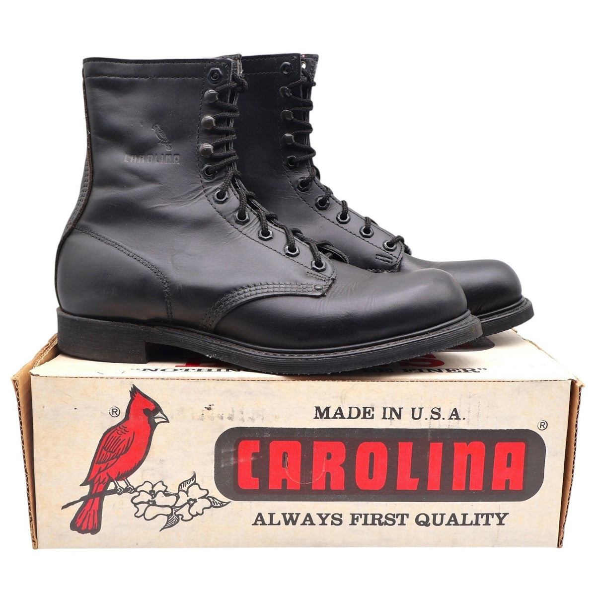 Black Carolina lace-up work boots, pair on a Carolina shoebox