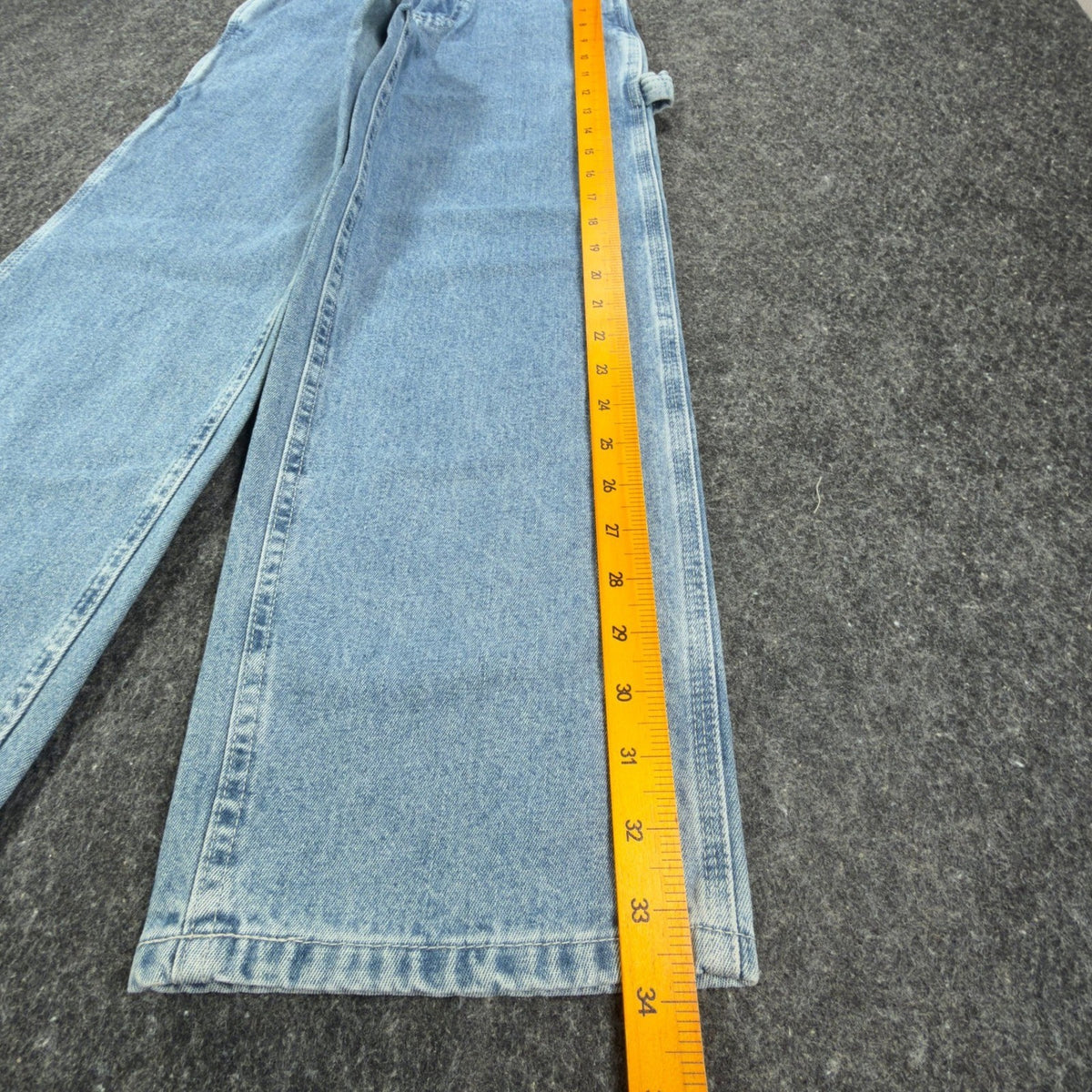 Ruler alongside the outer leg of light blue Lee wide-leg carpenter jeans