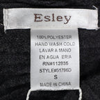 Close-up of Esley brand, size, fabric-content and care labels