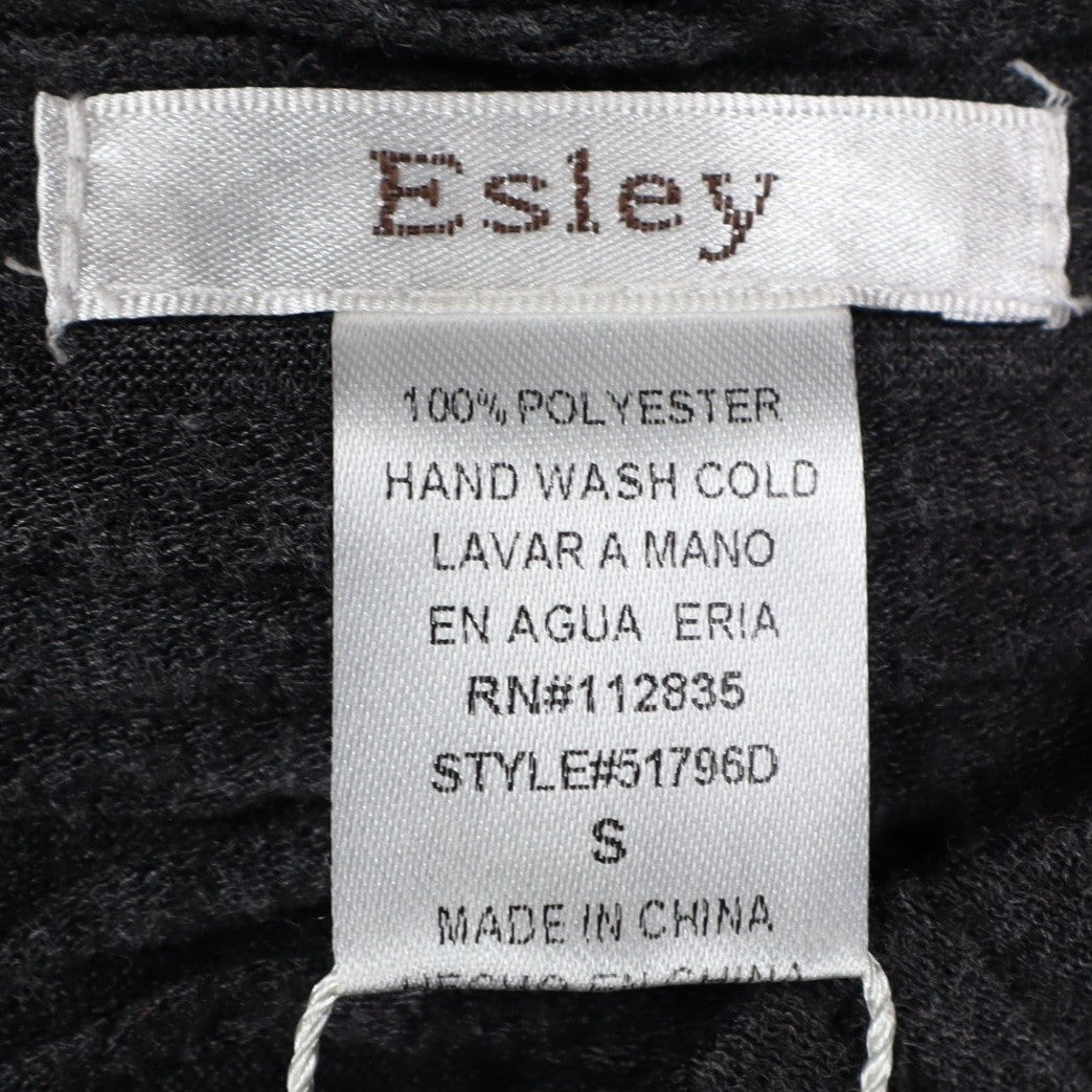 Close-up of Esley brand, size, fabric-content and care labels