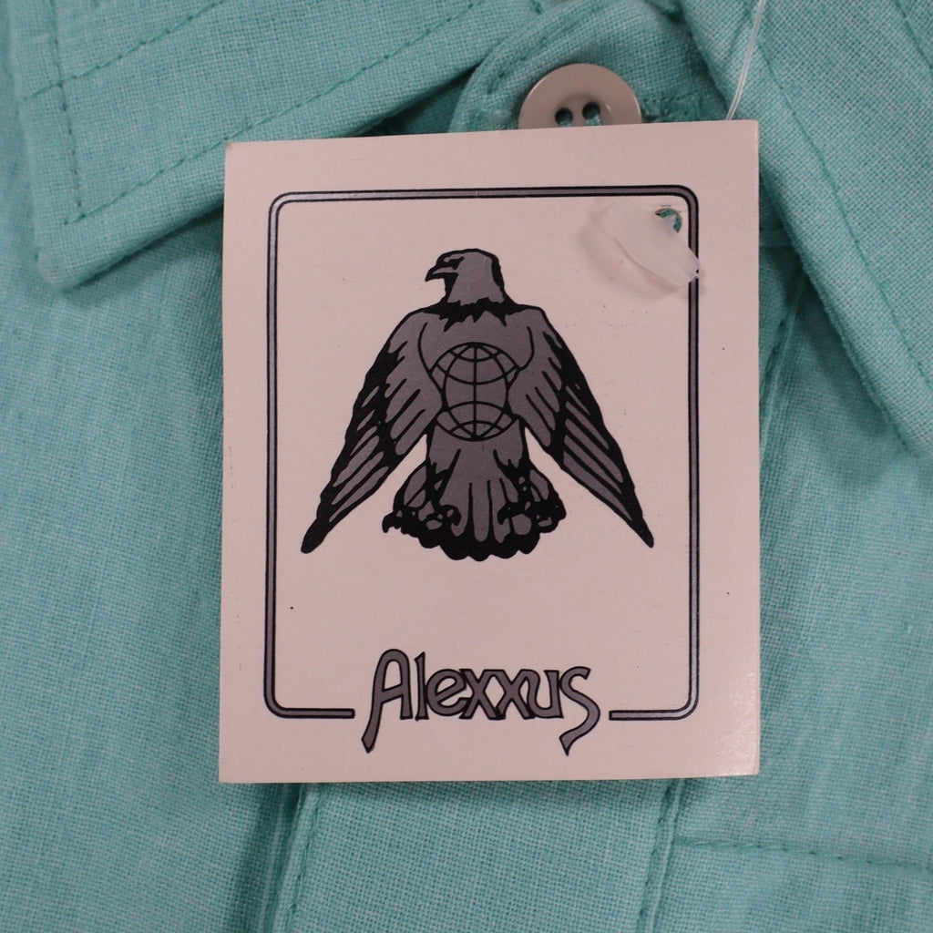Close-up of the eagle logo on an Alexxus hangtag