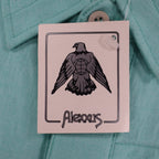 Close-up of the eagle logo on an Alexxus hangtag