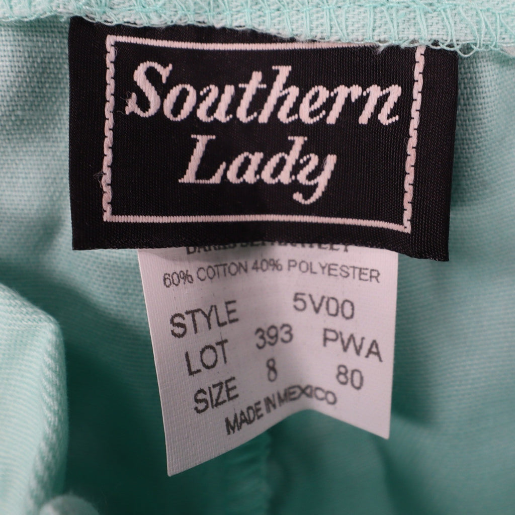 Aqua Southern Lady pleated shorts, brand and fabric labels