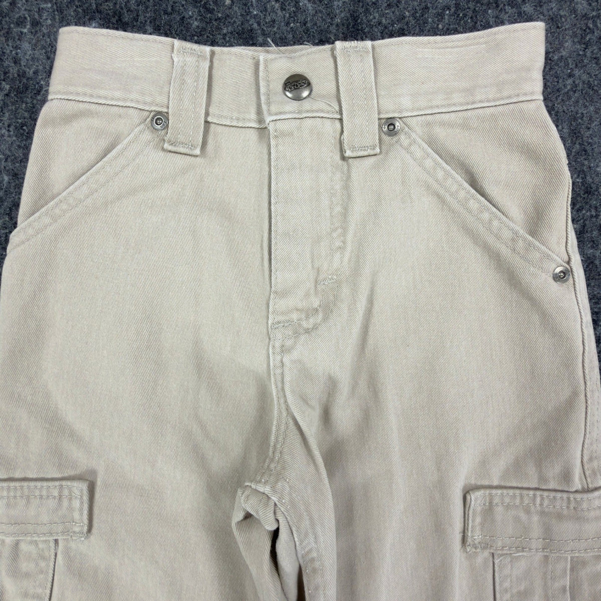 Close-up of the front of khaki Lee Pipes cargo shorts