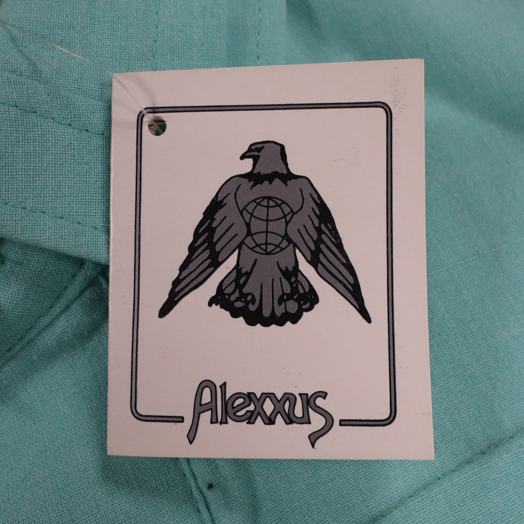 Close-up of the eagle logo on an Alexxus hangtag