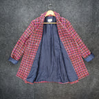 Pink, orange and navy AURA plaid double-breasted coat, front opened to show navy lining