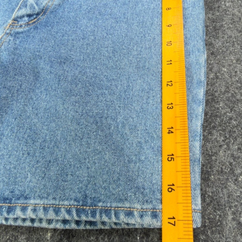 Ruler alongside the outer leg of blue Lawman denim shorts
