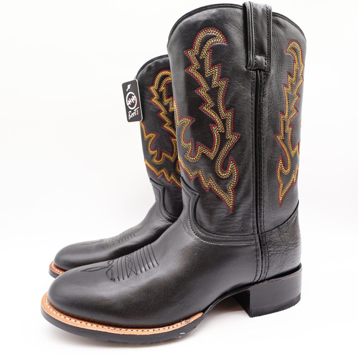 Three-quarter view of black Double-H western boots with multicolor shaft stitching with toes pointing left