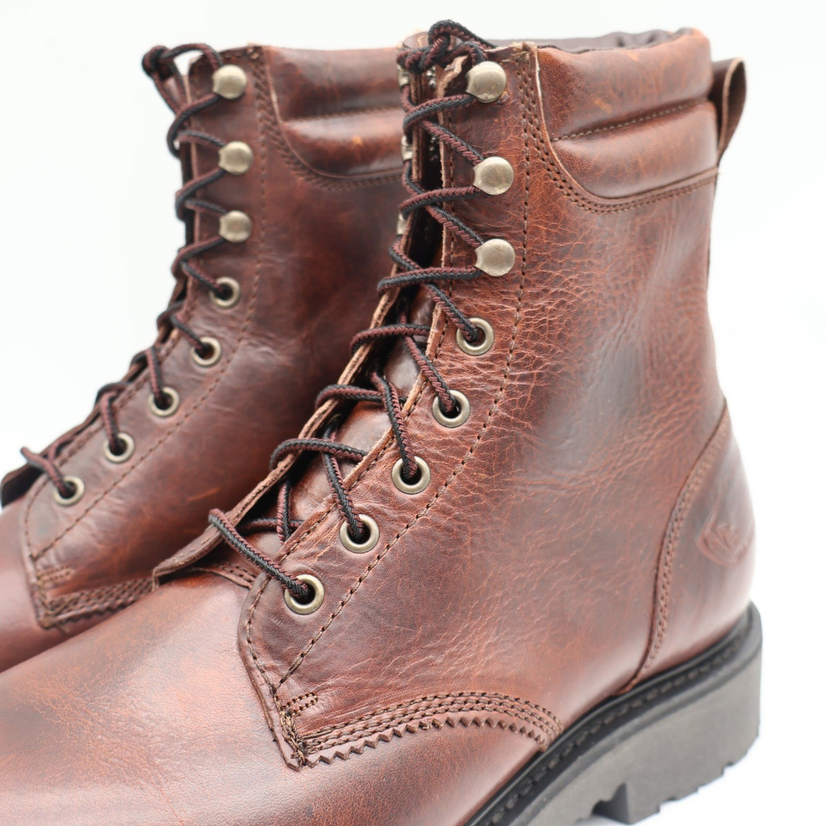 Reddish-brown Cape Shoe Company lace-up work boots, close-up of laces and speed hooks