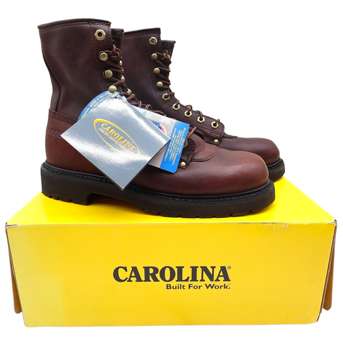 Brown Carolina lace-up work boots with hangtags on a yellow shoebox