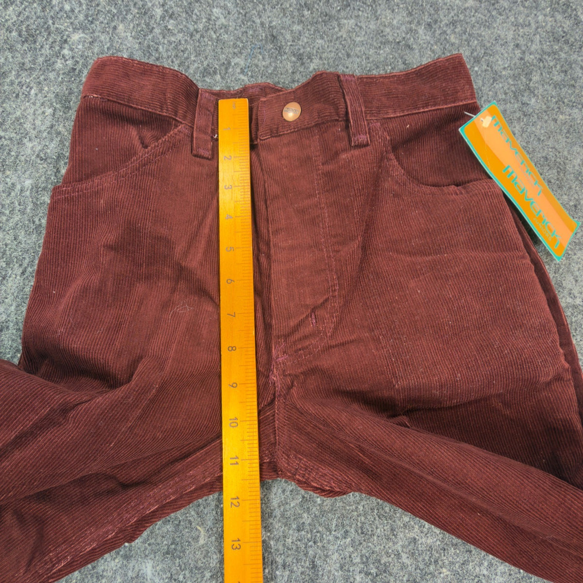 Reddish-brown Maverick flared corduroy pants, front rise ruler view