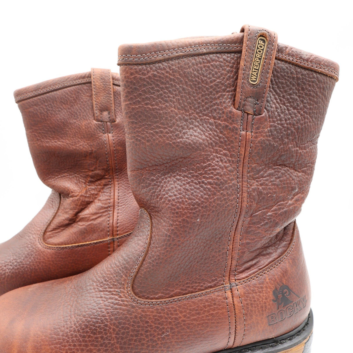 Close-up of the Rocky boots’ brown shafts, side stitching and pull tabs marked Waterproof