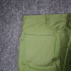 Close-up of a back patch pocket and belt loop on green Aldens pants