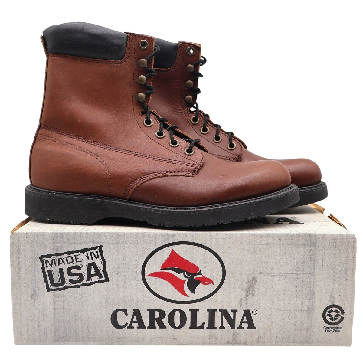 Brown Carolina work boots with black padded collars, pair on a Carolina box