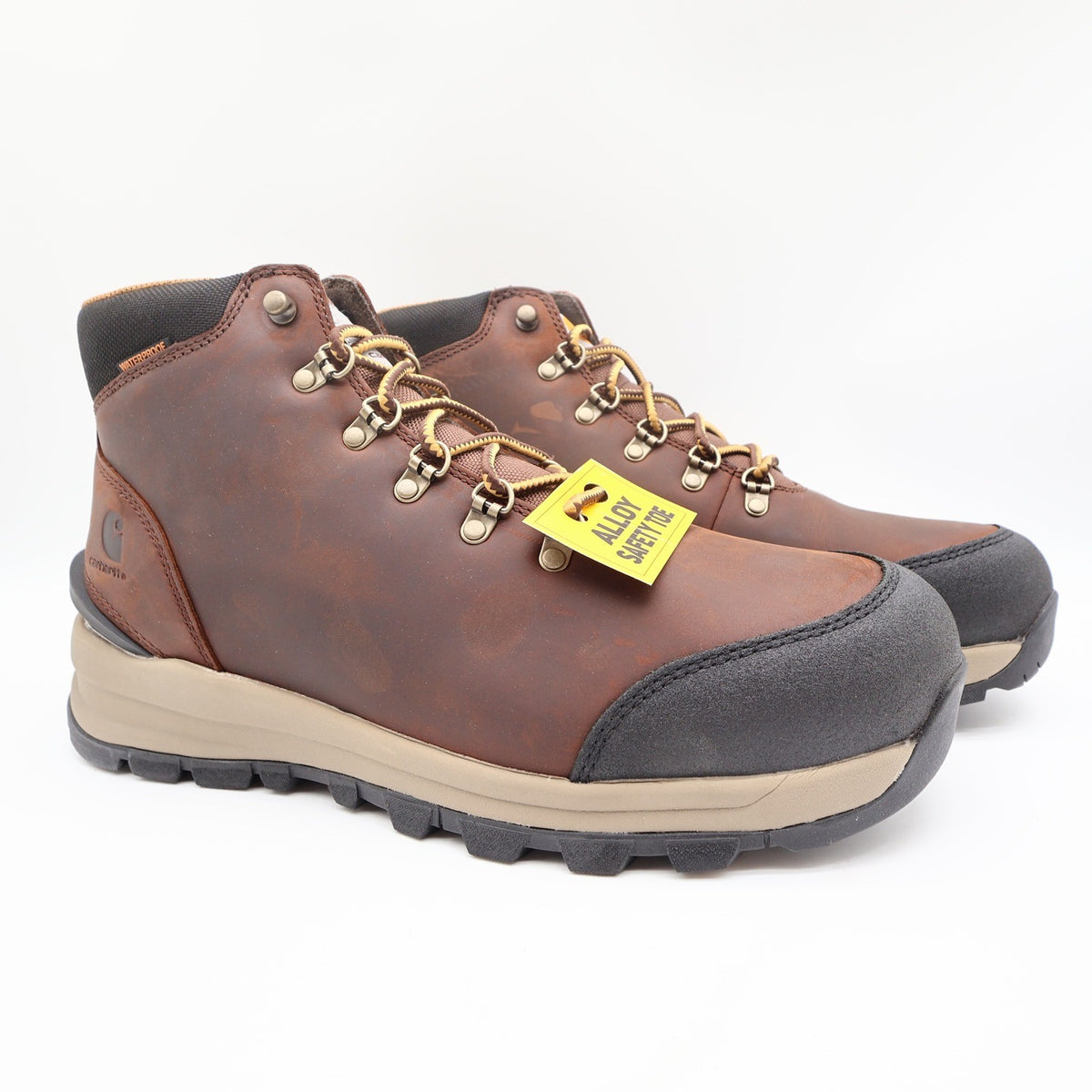 Brown Carhartt hiking-style work boots with black toe caps, angled front view with Alloy Safety Toe tag